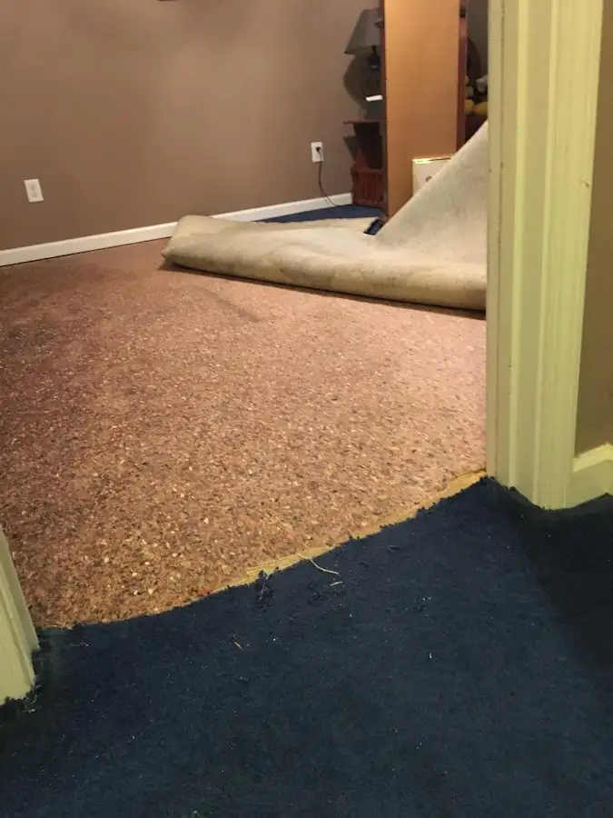 Carpet pad removal revealing water damage during Water Mitigation Services in Hermiston